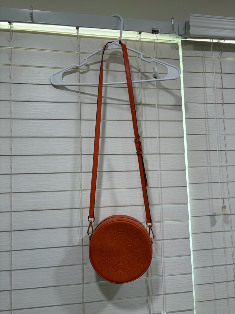 Michael Kors Orange Round Crossbody with Embossed Logo